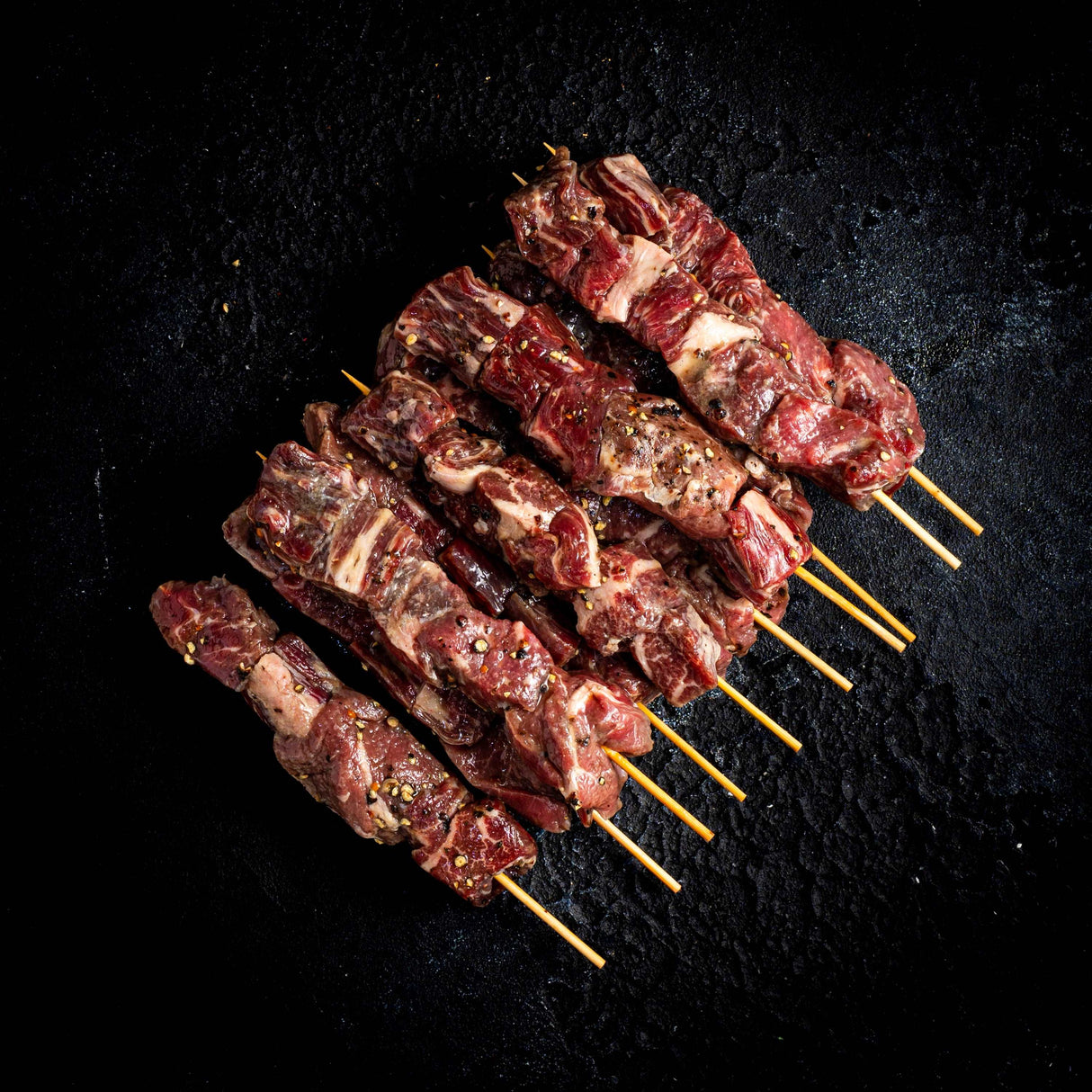 a close up of a grill with meat on it