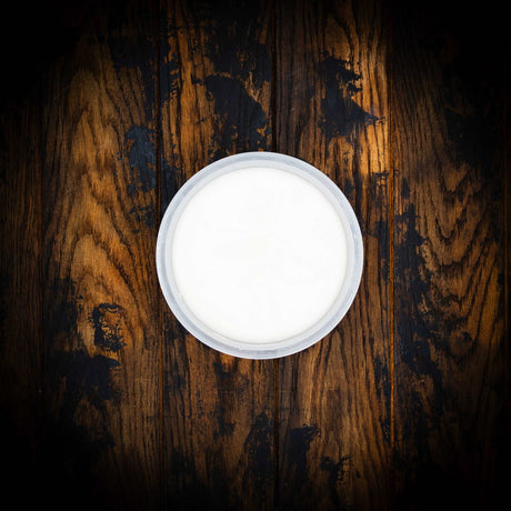 a white toilet sitting on top of a wooden table