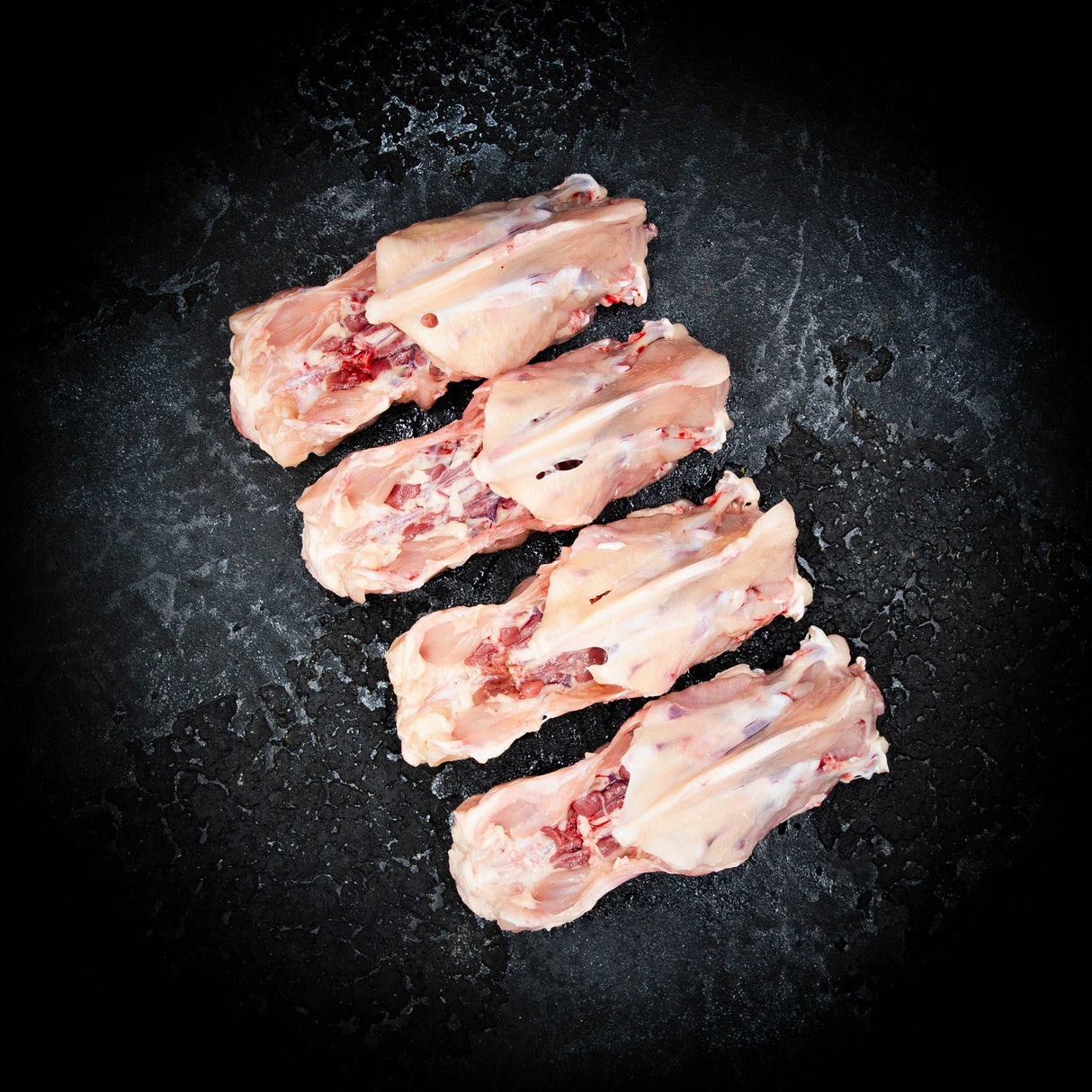 a group of hot dogs on a grill