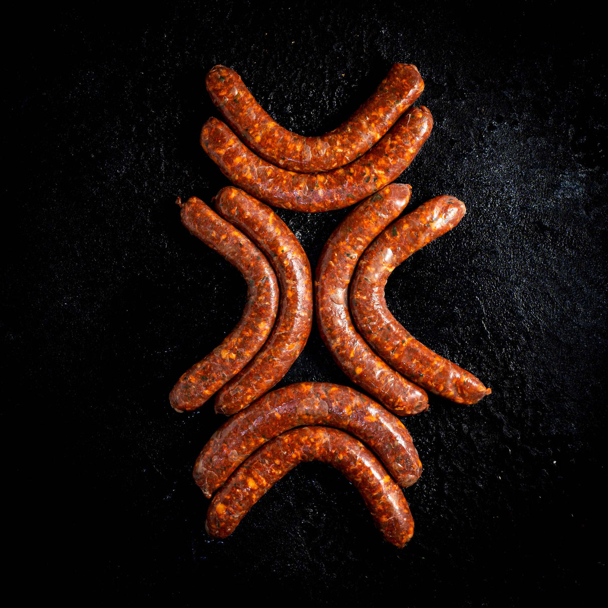 a pile of carrots sitting on top of a grill