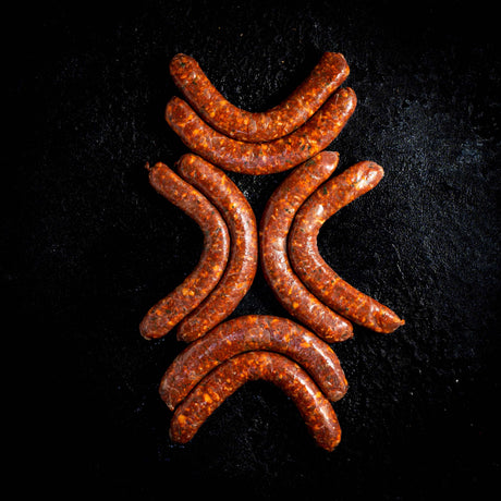 a pile of carrots sitting on top of a grill