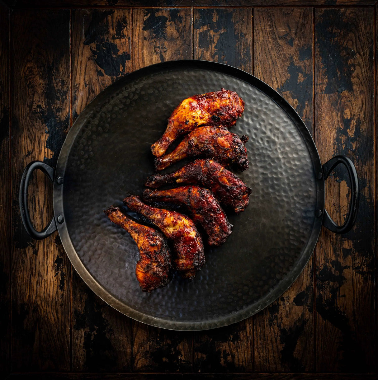 a plate of food that is on a grill