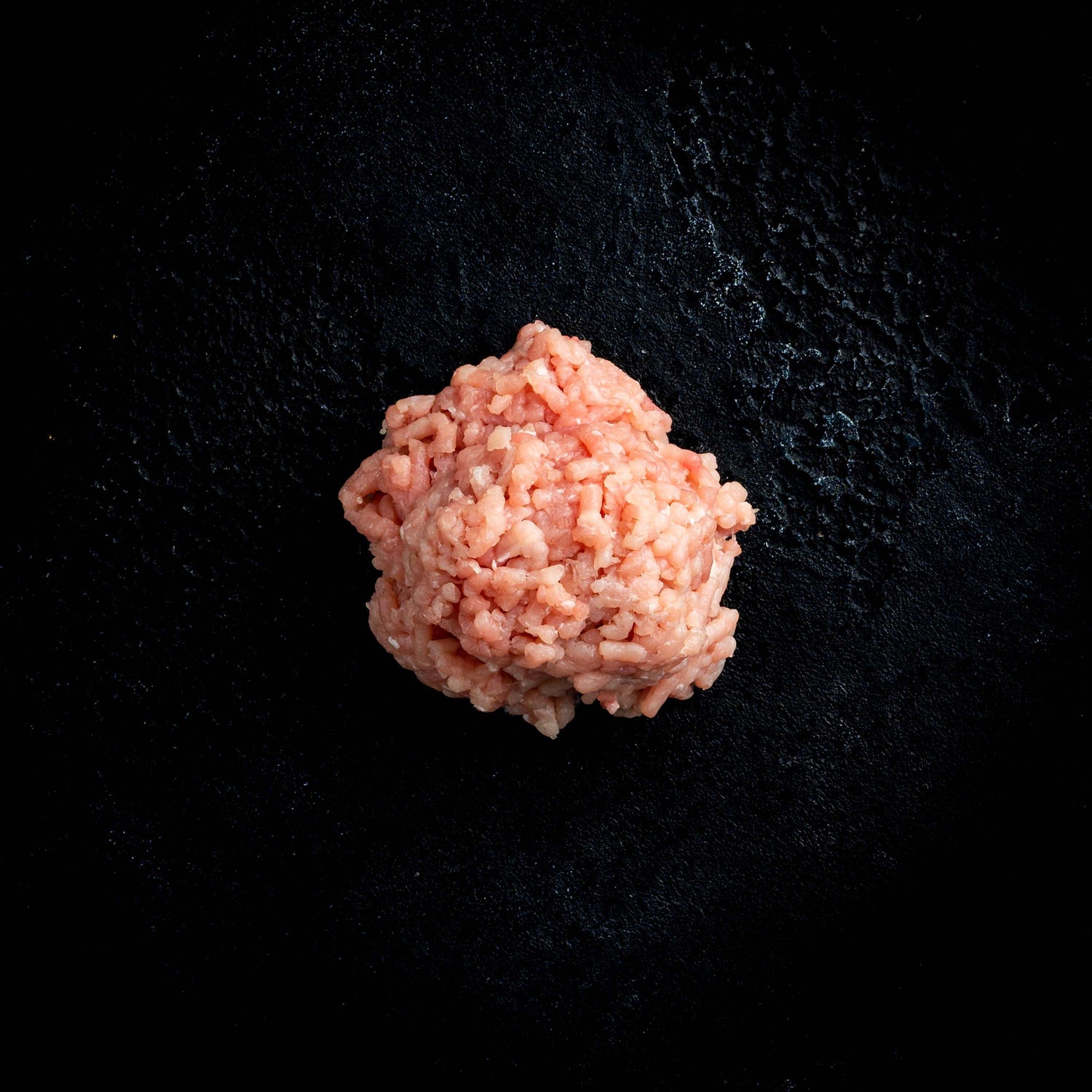 a close up of a flower in a black vase
