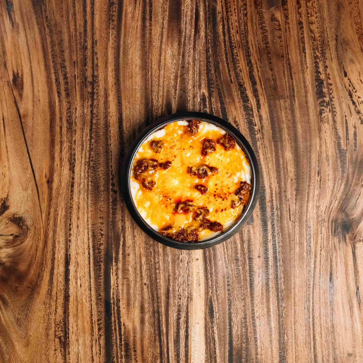 Wagyu ragu, rich with broth, tomatoes, and onions