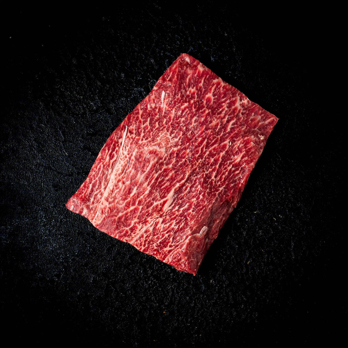 a red umbrella is sitting on the ground