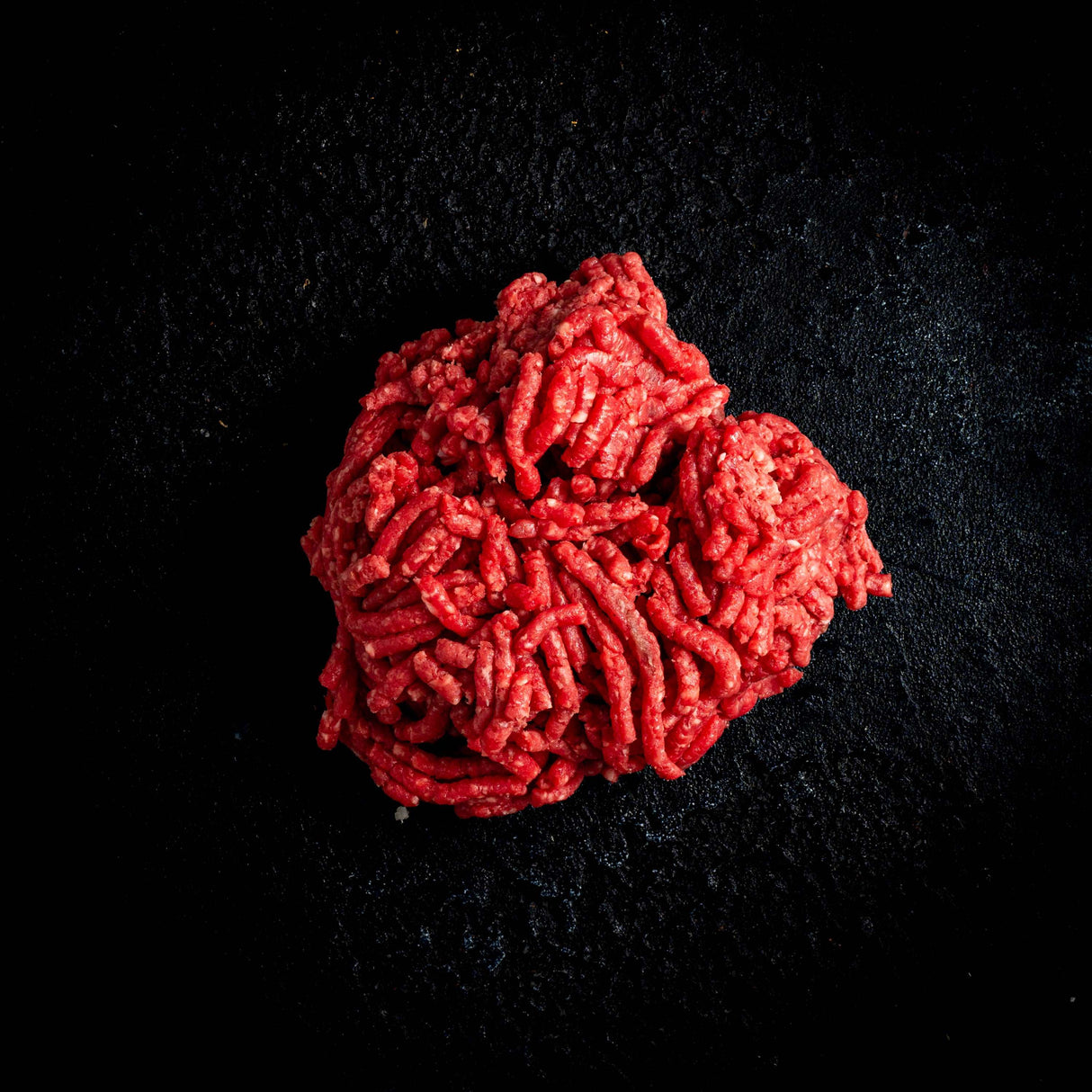 a picture of a red rose on a black background
