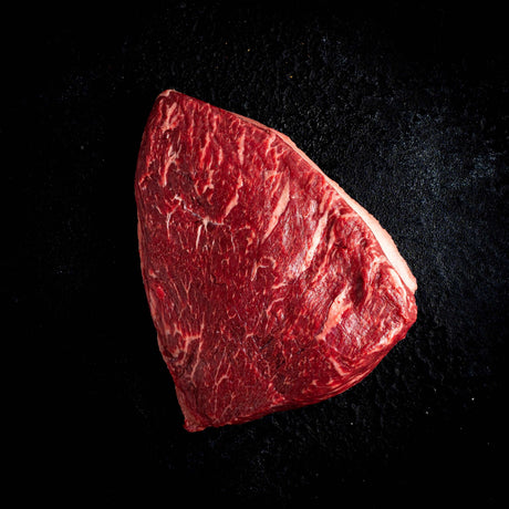 a red frisbee sitting on top of a black surface