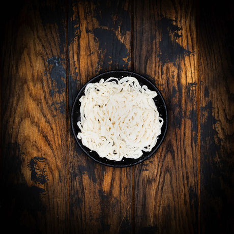 a close up of a cake on a wooden table