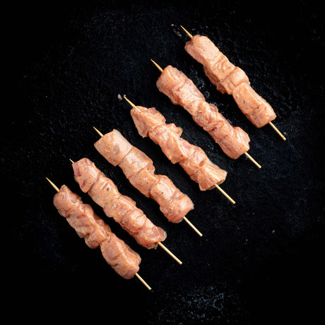 a bunch of hot dogs on a grill