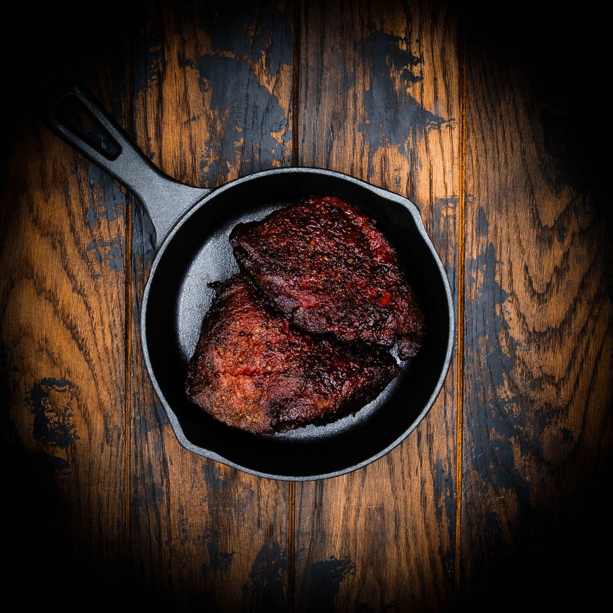 a close up of a plate of food on a wooden table