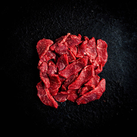 a red rose is in a black vase