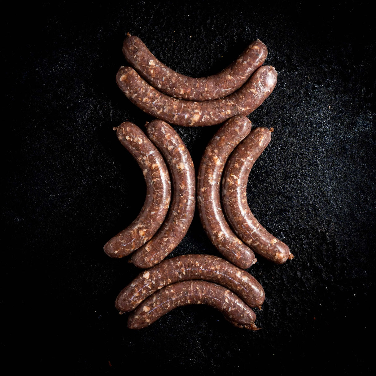 a close up of a vase on a black surface