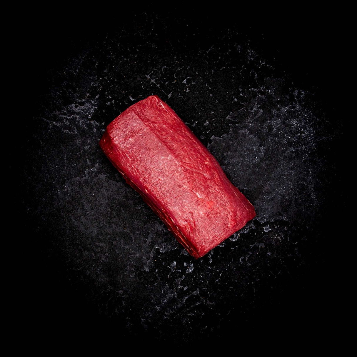 a red object that is laying on the ground