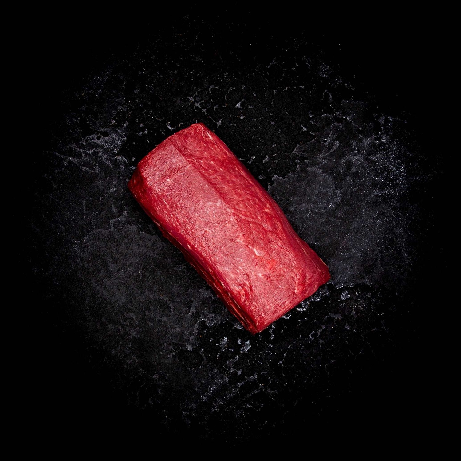 a red object that is laying on the ground