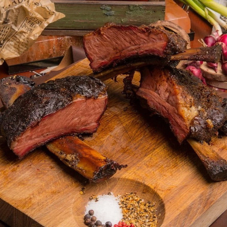 a close up of a plate of food on a wooden table