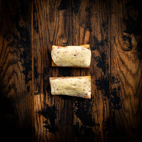 a wooden bench sitting in the middle of a forest 