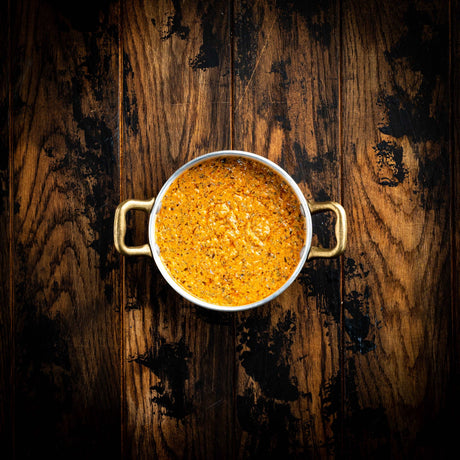 a close up of a cup of coffee on a table 