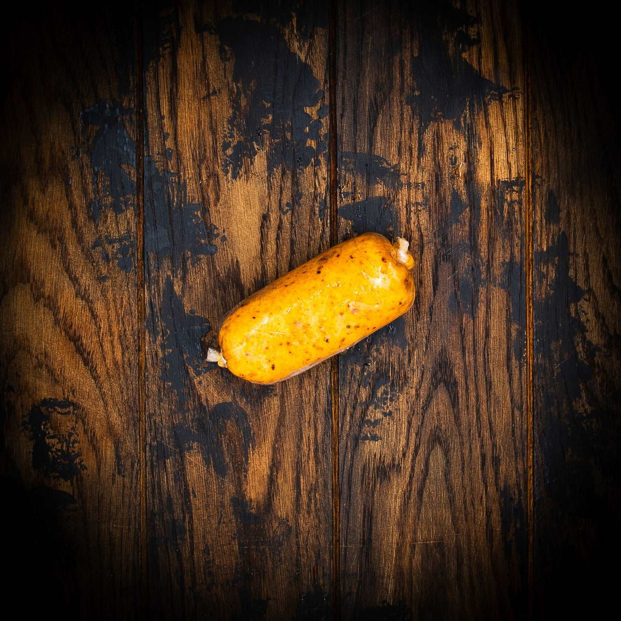 a yellow banana sitting on top of a wooden table 