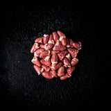 a red rose in a red vase on a black background 