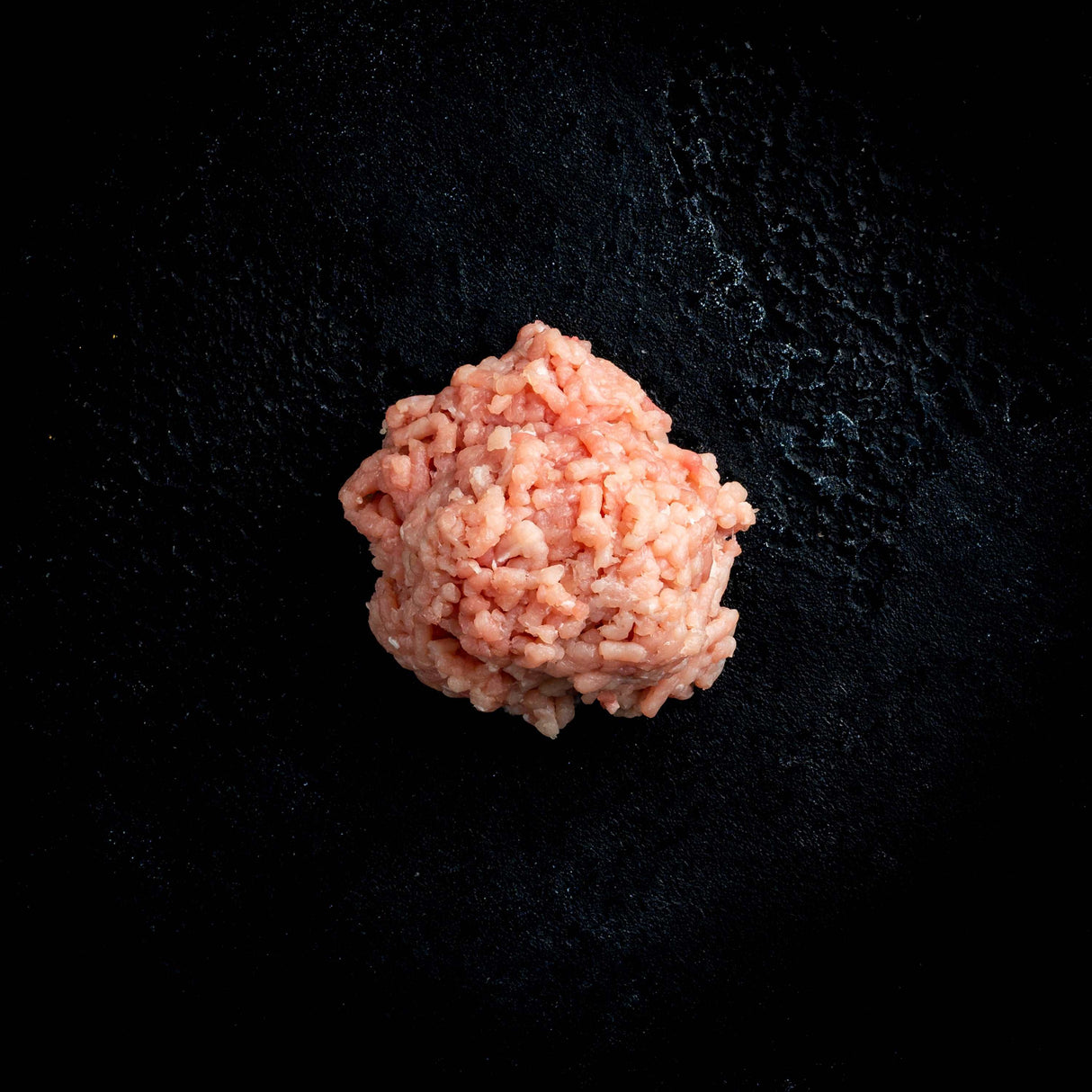 a close up of a flower in a black vase 