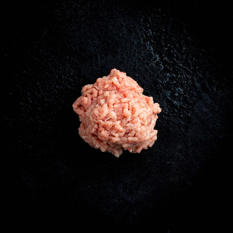 a close up of a flower in a black vase 