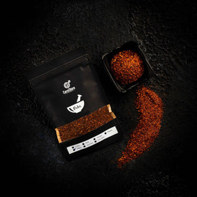 a laptop computer sitting on top of a black table 