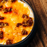 Wagyu ragu, rich with broth, tomatoes, and onions