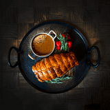 a pan filled with food on top of a stove 