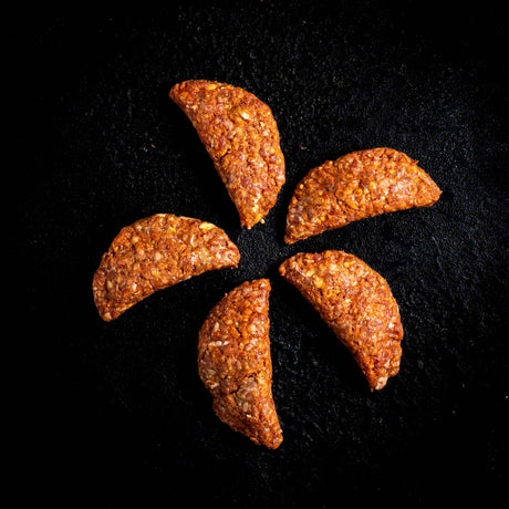 a close up of a peeled orange on a black background 