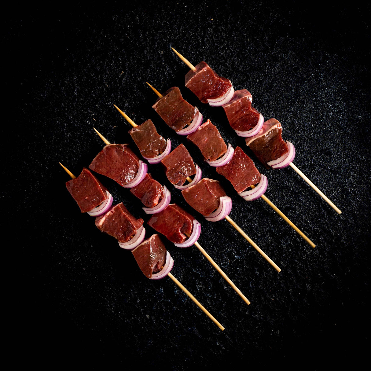 a bunch of chocolate cupcakes on a grill 