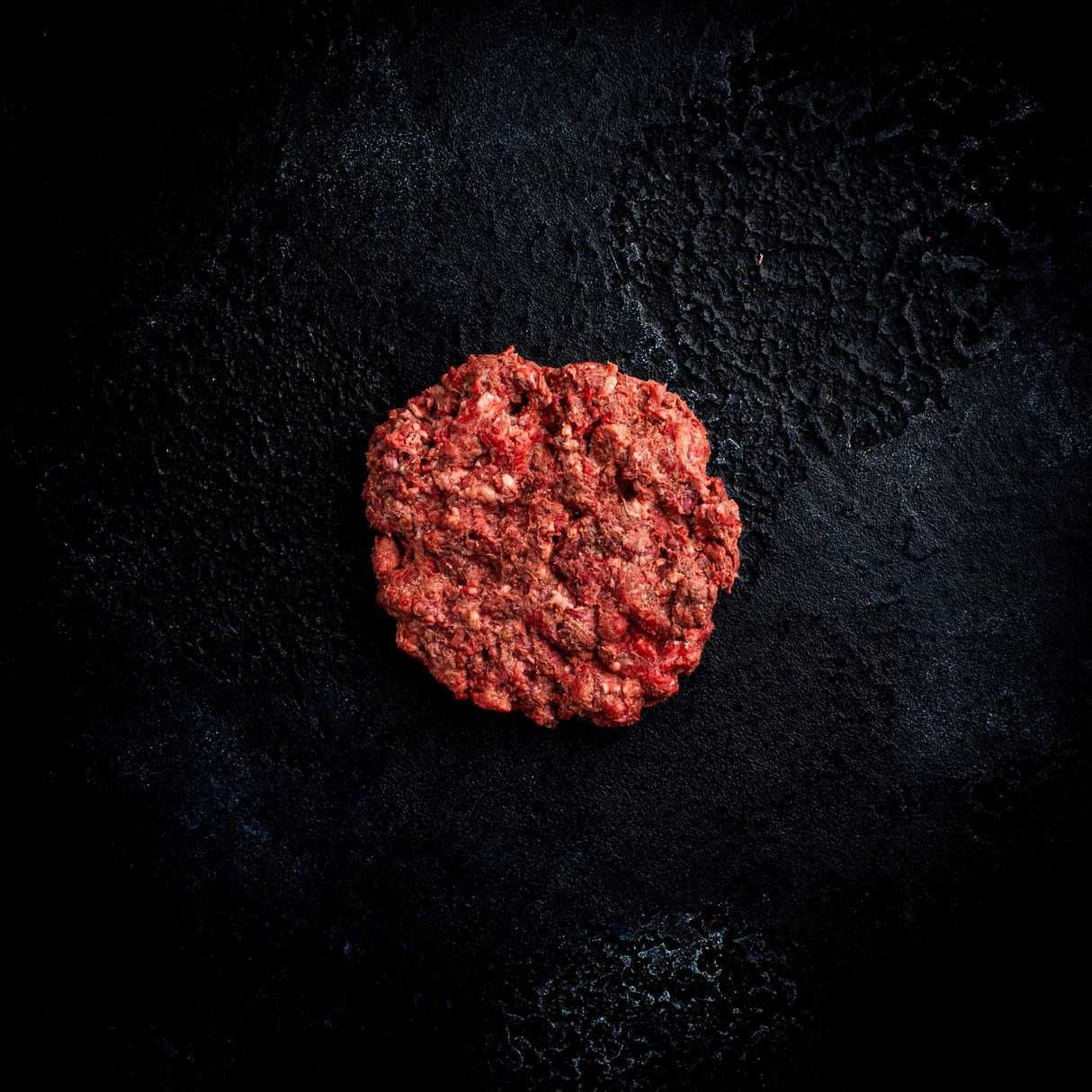 a close up of a red and black frisbee 