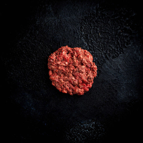 a close up of a red and black frisbee 