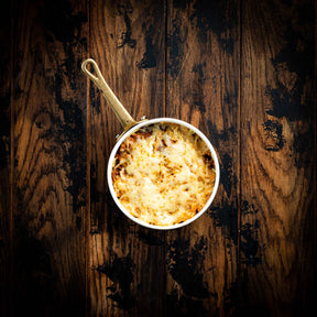 a close up of a bowl of food on a table 