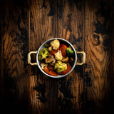 a close up of a bowl of food on a table 