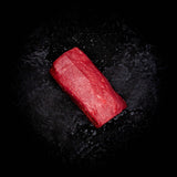 a red object that is laying on the ground 